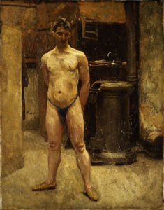 A Male Model Standing before a Stove